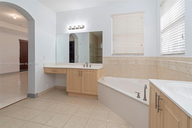 bathroom featuring vanity, separate shower and tub, and tile patterned flooring