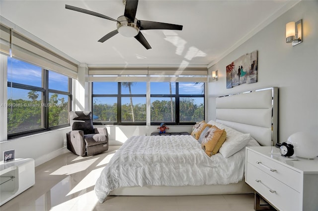 tiled bedroom featuring crown molding and ceiling fan