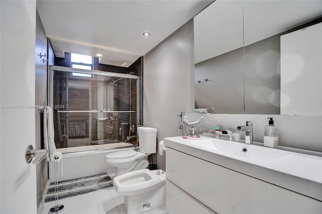 full bathroom with toilet, tile patterned flooring, a bidet, vanity, and combined bath / shower with glass door