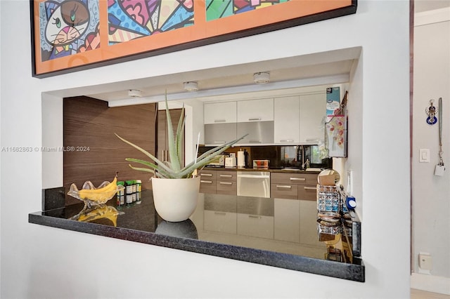 interior space featuring sink and dishwasher