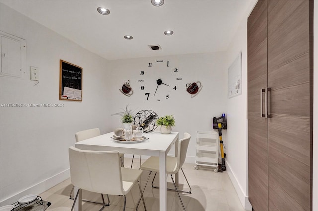 dining area featuring light tile patterned floors