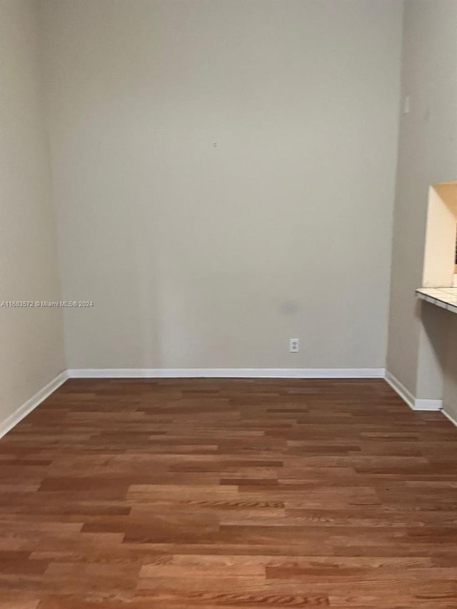 unfurnished room featuring hardwood / wood-style floors