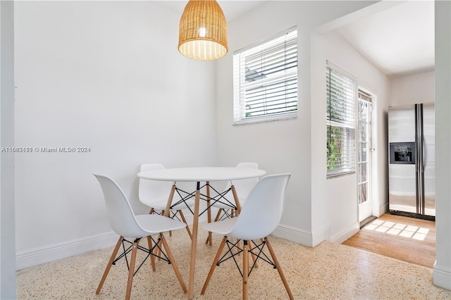 dining room with wood-type flooring