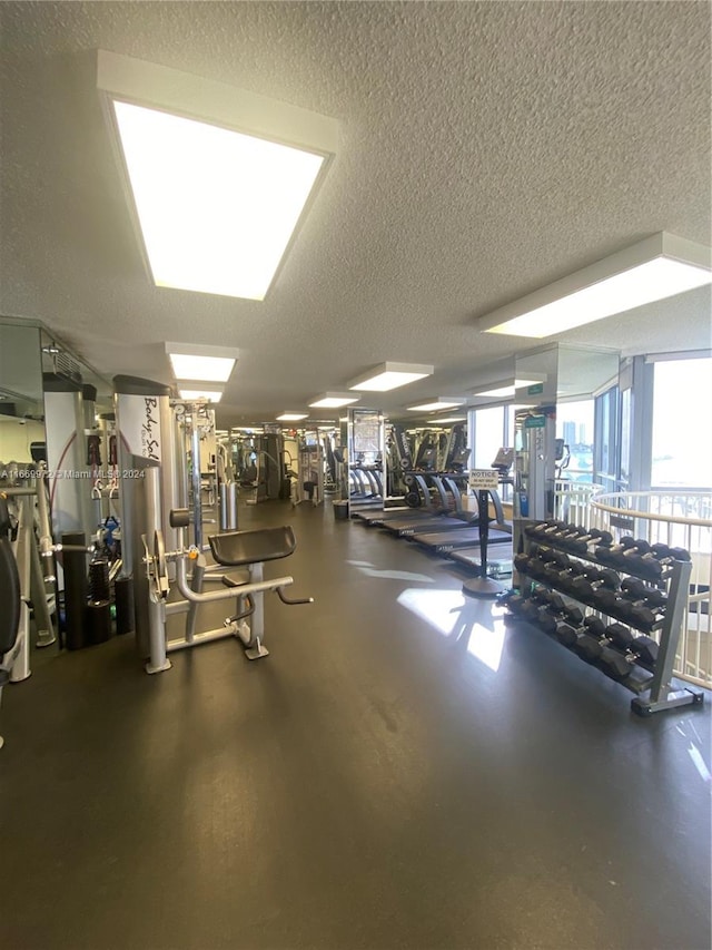 workout area featuring a textured ceiling