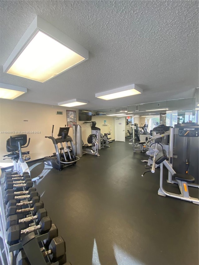 workout area with a textured ceiling