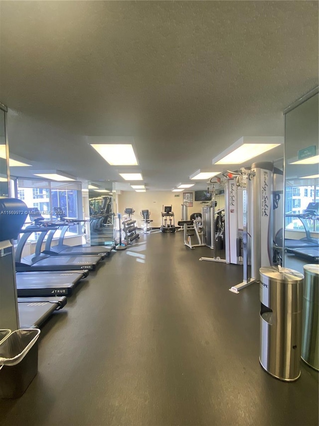 workout area featuring a textured ceiling