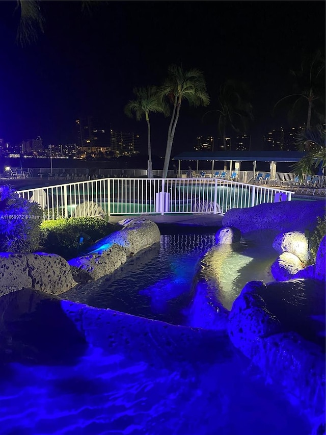 view of pool at night