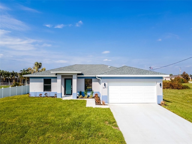 view of front of property featuring a front lawn and a garage