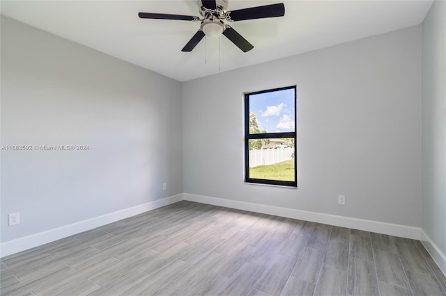 empty room with light hardwood / wood-style floors and ceiling fan