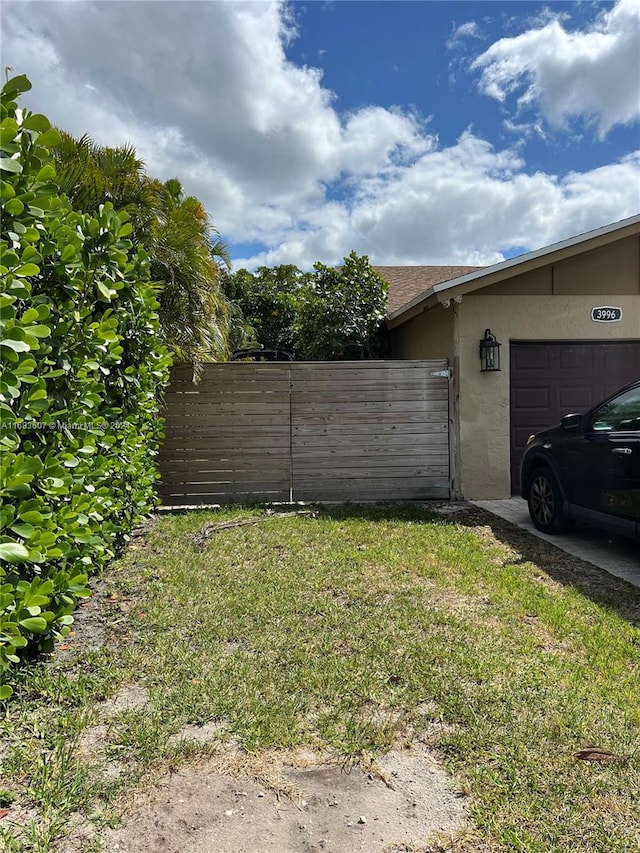 view of yard with a garage