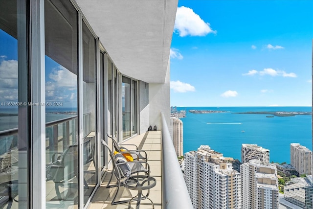 balcony featuring a water view