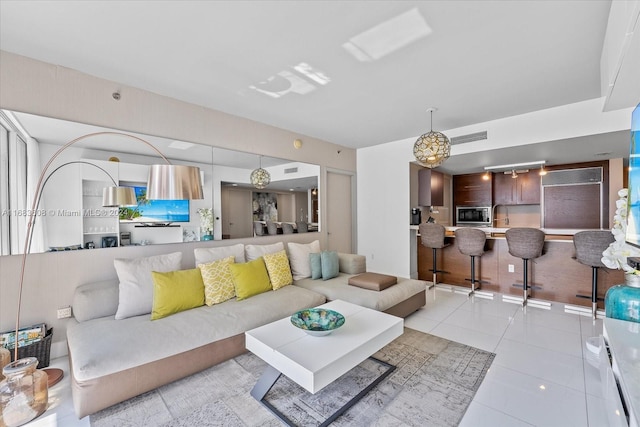 living room with light tile patterned floors