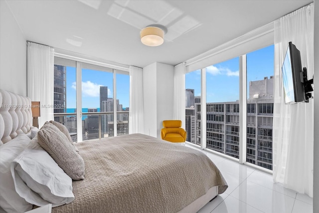 bedroom with multiple windows and light tile patterned floors