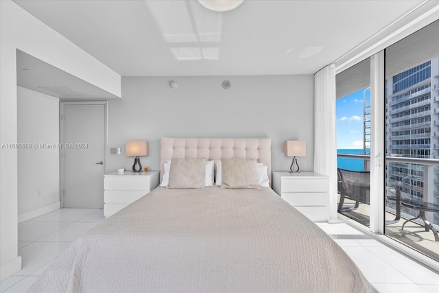 tiled bedroom featuring access to outside