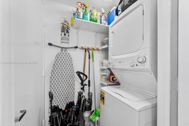 laundry area with stacked washer / dryer