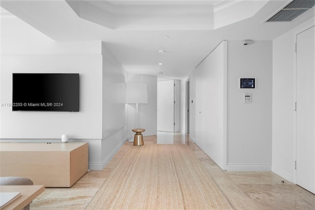 corridor featuring light tile patterned floors