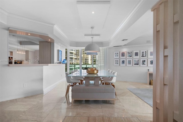 dining area featuring crown molding