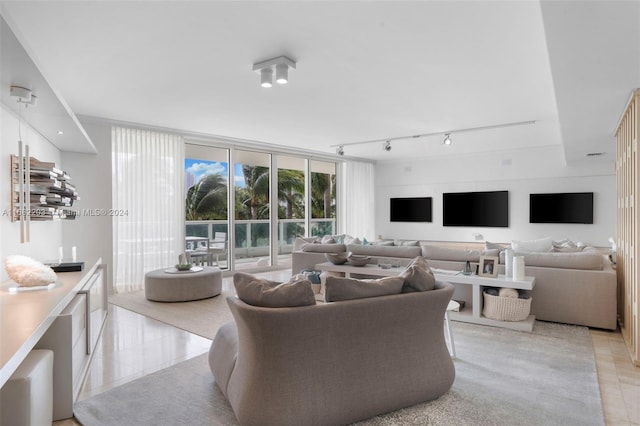 tiled living room featuring rail lighting