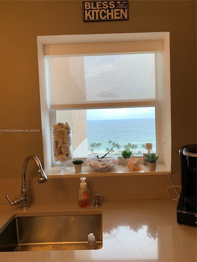 interior details featuring sink and a water view