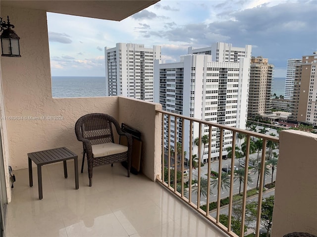 balcony featuring a water view