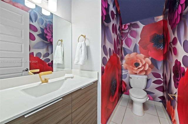 bathroom with vanity, toilet, and tile patterned flooring