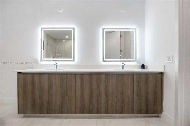 bathroom with vanity and a shower with shower door