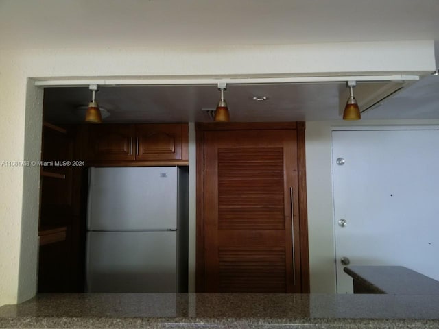 kitchen featuring stainless steel refrigerator