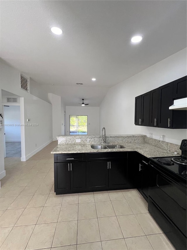 kitchen featuring kitchen peninsula, light stone countertops, light tile patterned flooring, black electric range, and sink