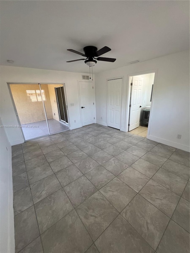 unfurnished bedroom with connected bathroom and ceiling fan