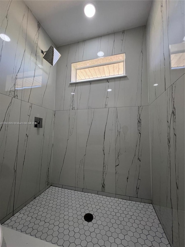 bathroom with tiled shower