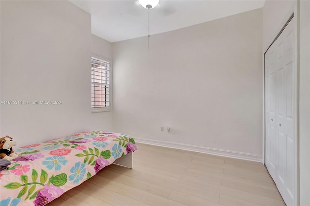 bedroom featuring a closet and light hardwood / wood-style floors