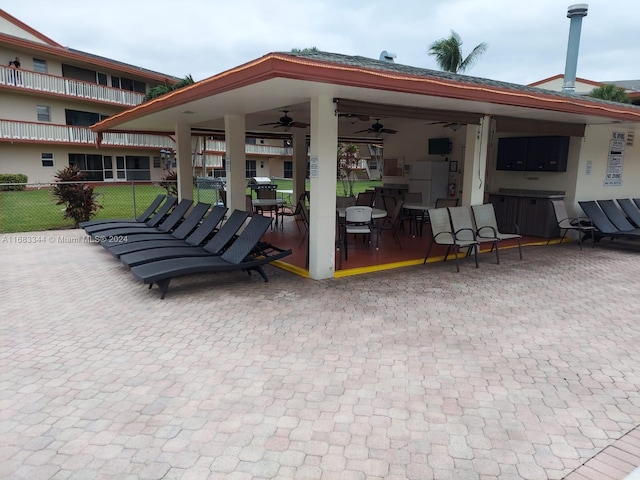 view of patio / terrace with a balcony and ceiling fan