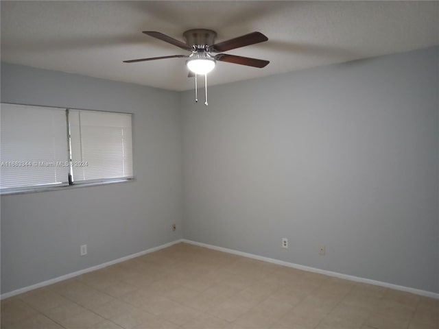 spare room featuring ceiling fan