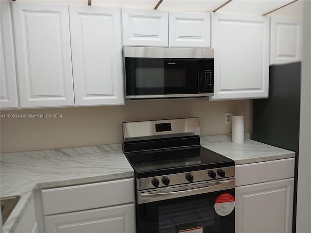 kitchen with white cabinets and stainless steel appliances