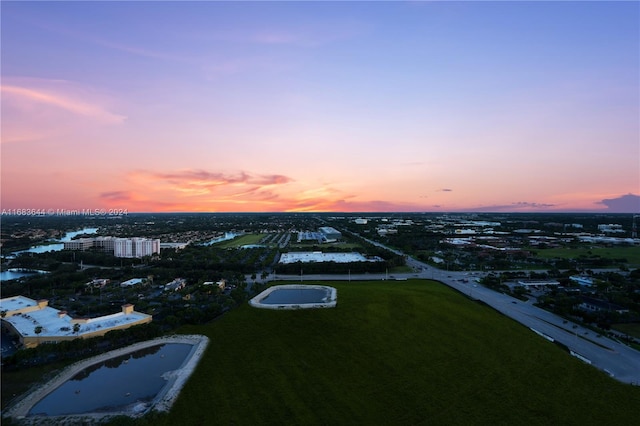 aerial view at dusk with a water view