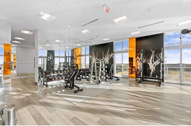 gym with a wall of windows