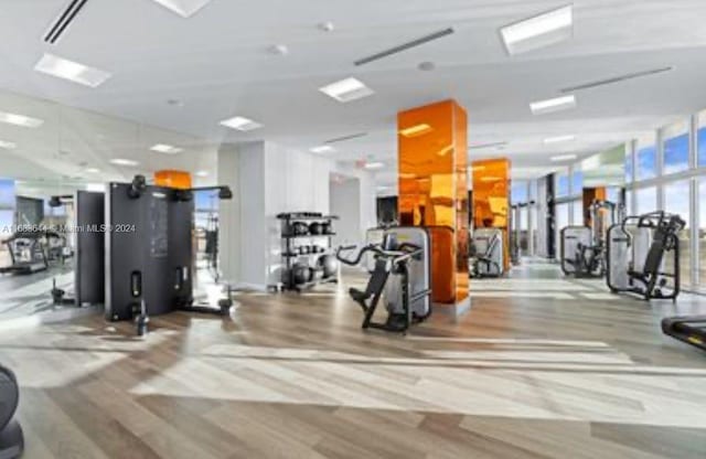 workout area featuring expansive windows