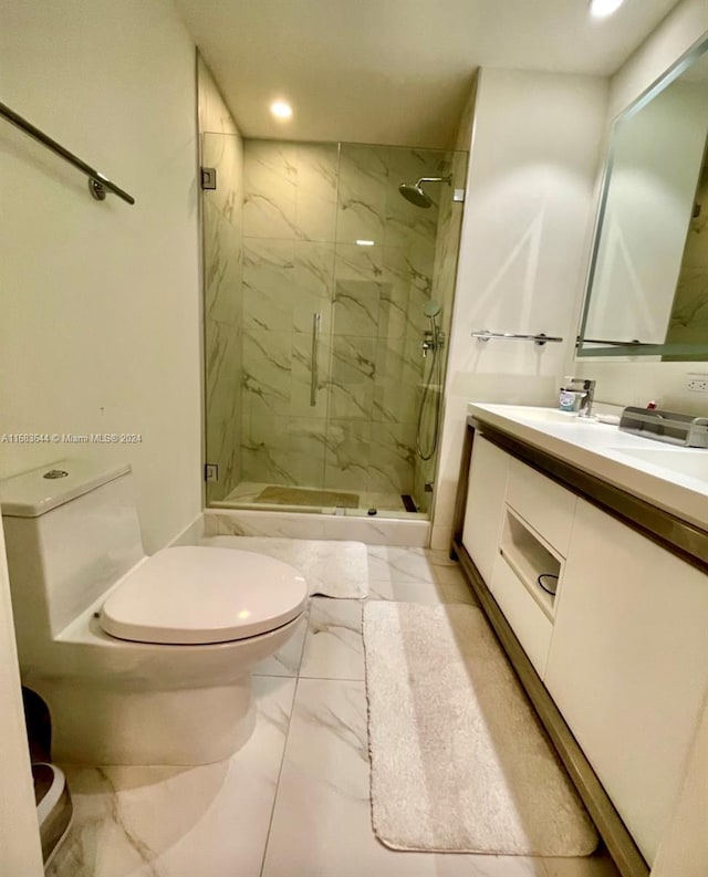 bathroom with toilet, walk in shower, and vanity