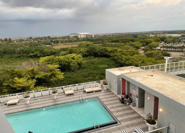 view of swimming pool featuring a patio area