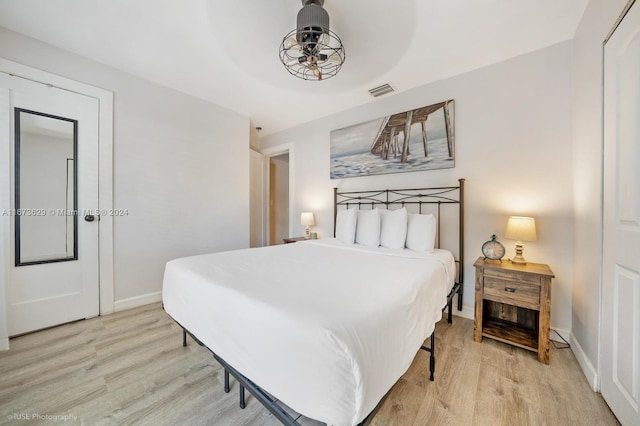 bedroom with light hardwood / wood-style floors