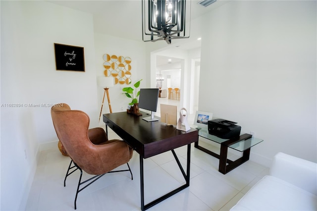 tiled home office with a notable chandelier