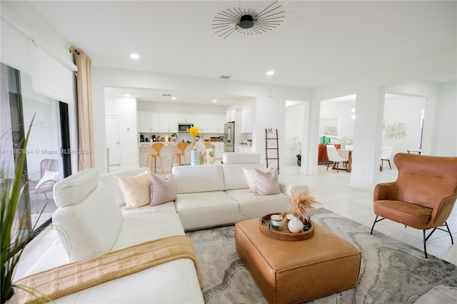 living room featuring light tile patterned flooring