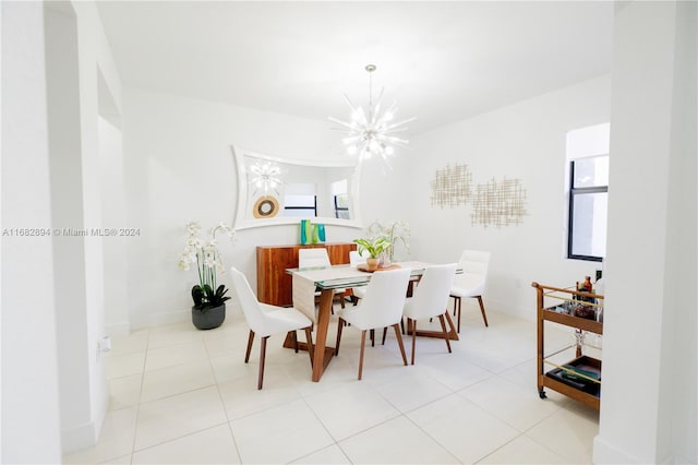 tiled dining space with a notable chandelier