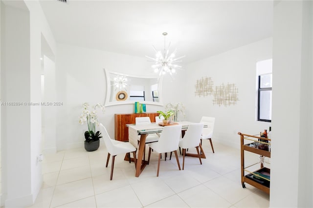 tiled dining area with a chandelier