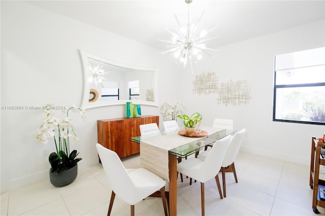 dining space featuring an inviting chandelier and light tile patterned floors