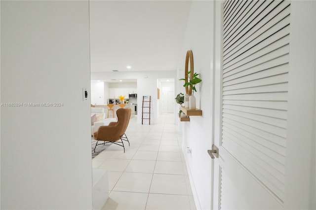 hallway featuring light tile patterned floors