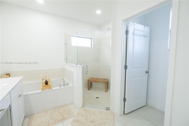 bathroom with vanity, independent shower and bath, and tile patterned flooring