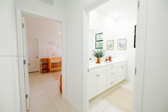 hallway with light tile patterned floors