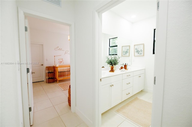 corridor with light tile patterned floors