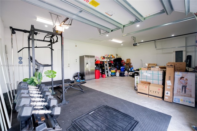 garage featuring a garage door opener and electric panel